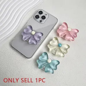 Cute handle candy color bowknot mobile phone stand, lazy person's desktop folding stand, three-dimensional flower bowknot mobile phone airbag stand, Smartphone mount, adhesive type, adjustable, small batch, gift for friends