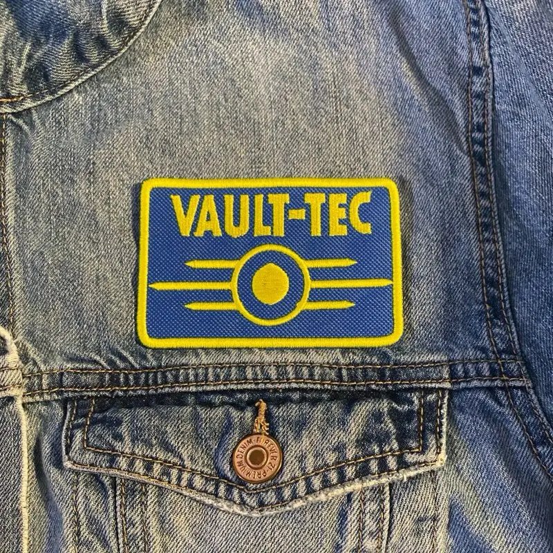 Stitched Embroidery Vault-Tec Inspired Fabric Patch - 1 Count (Pack of 1), Blue & Yellow, 2.48x3.82in, Sew-On/Iron-On/Hook Backing, 2 Hooks, Universe Design, Jacket Decor, Cosplay Accessory for Fallout Fans