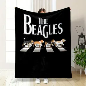 The Beagles Blanket, a fun parody of the iconic Beatles Abbey Road album cover, features four cute beagle dogs walking across the zebra crossing. Made with soft and cozy material, it's perfect