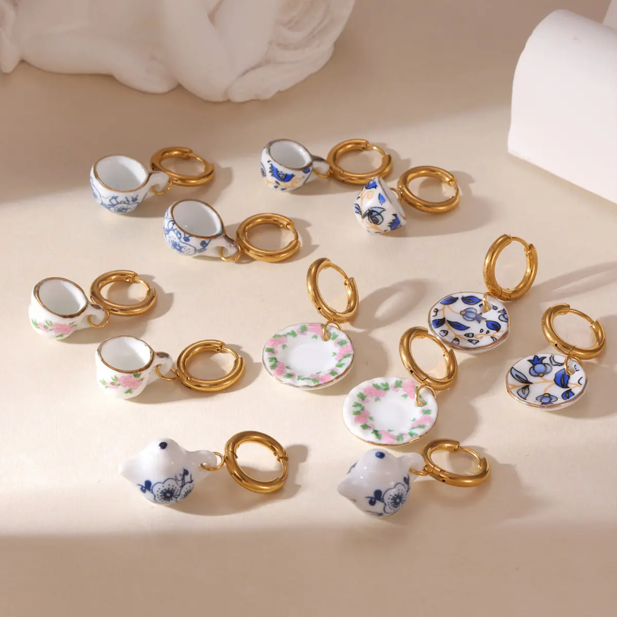 Ceramic blue and white porcelain earrings, cups, plates, flower pendants, and ear studs