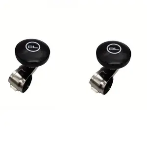 Two carbon fiber steering wheel knobs and a car steering assist