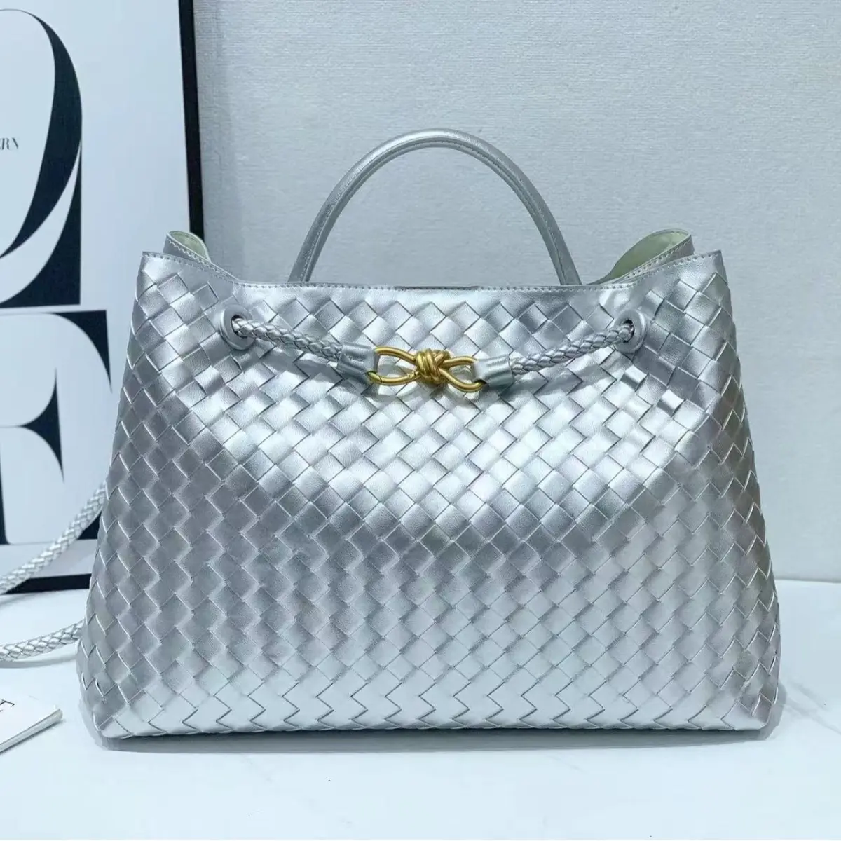 Niche Commuter Tote Bag with Metal Rope Buckle Woven Handbag Large Capacity Vintage Bucket Design in Silver for Daily Use