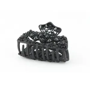 Black metal hair claw clip with black stones on a tiny floral pattern