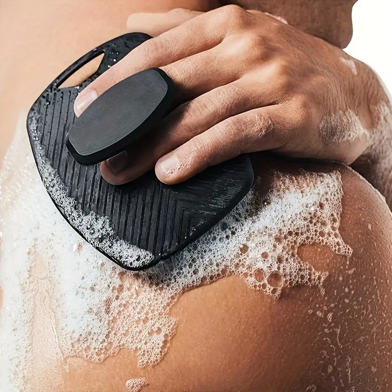 Men's exfoliating brush with ergonomic non-slip handle. Rinses clean easily, battery-free. For shower or bath. Includes exfoliating bath sock. Essential for men's grooming