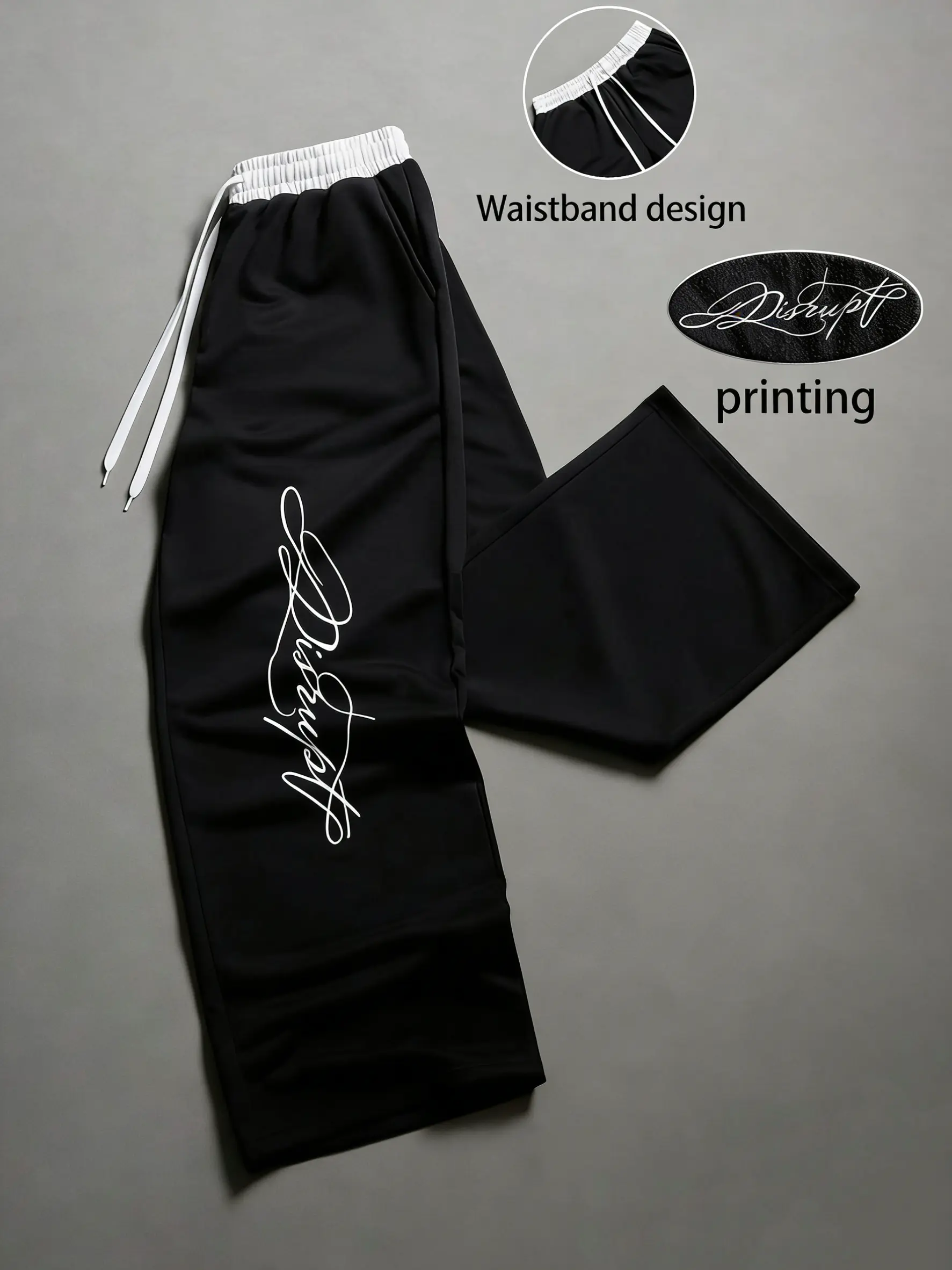 Unisex Y2K street-style athletic pants—casual loose-fit drawstring pants with black-and-white contrast and a faux two-piece belt design featuring unconventional font prints. These relaxed straight-leg pants are very comfortable to wear and perfect for eve