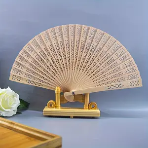 1PC Fashion Wooden Folding Fan – Hollow Carved Bamboo Hand Fan, Bohemian Style, Lightweight Portable Photography Prop, Perfect Graduation Gift for Women & Home Decor Accessory