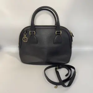 Pre-owned GUCCI Calfskin Top Handle Bags Black Leather Dome with GG Charm Handbag Classic Grained with Gold Tone Hardware & Detachable Strap for Everyday Use