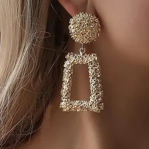 Glamorous Gold Textured Drop Earrings Rough Lava Finish Geometric Round and Rectangular Shape Eye Catching Accessory for Parties Date Nights and Fashion Forward Looks Cross Necklace ring Surgical Steel Stud Set Mesh Water tiara Silver Versatile Pendant