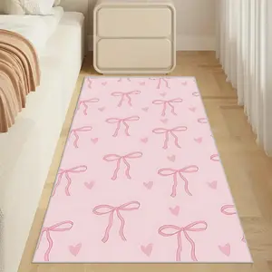 A bedside carpet with pink bow patterns, crafted from soft cashmere-like fabric, ideal for bedrooms, living rooms, and as a sofa decorative mat. It is a lovely interior and home decor with a stylish design.
