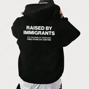 Women's Raised By Immigrants Graphic Hoodie - Cotton Blend Black Long Sleeve Pullover Regular Fit | Soft & Breathable Fabric, Durable Print, Everyday Comfort, Machine Washable, casual streetwear urban lifestyle
