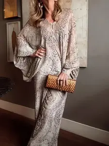 This Urban Chic Outfit Features a Batwing Sleeve Chiffon Top with a Floral Print And Snake Pattern, Paired with Straight-Leg Pants That Have an Elastic Waistband, Making It Suitable for Various Occasions
