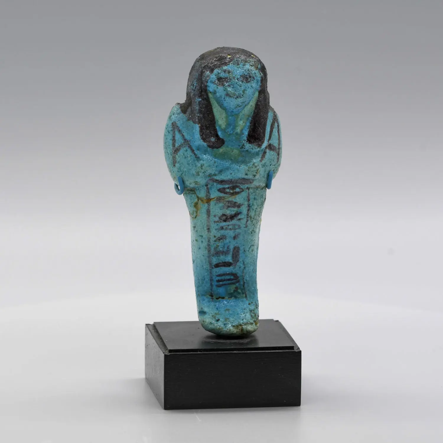 An Egyptian bright blue glazed shabti for Meret-Amun, 21st Dynasty, Thebes, Deir el Bahri Cache II, ca. 990 - 970 BCE