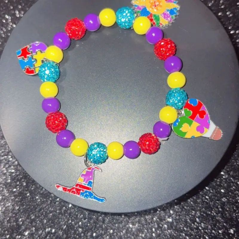 Multi Colored Beaded Bracelet with Puzzle Piece Charm