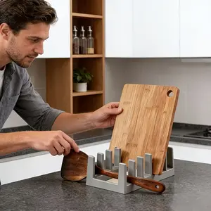 1-piece multi-functional storage rack: serves as a pot lid holder, dish rack, spoon rack, cutting board holder, and book storage solution. It facilitates the storage of pot lids and spoons while allowing for proper drainage. Ideal for modern kitchens and