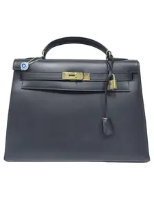 Pre-owned france Clutches & Wristlets Hermès Black and Gold Kelly 32 (SZ 67869)