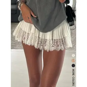 Women’s lace mini skirt with a low-rise pleated hem, layered design, semi-smooth finish, elastic waistband, floral mesh fabric, and a sexy short underskirt. GARMENTARY