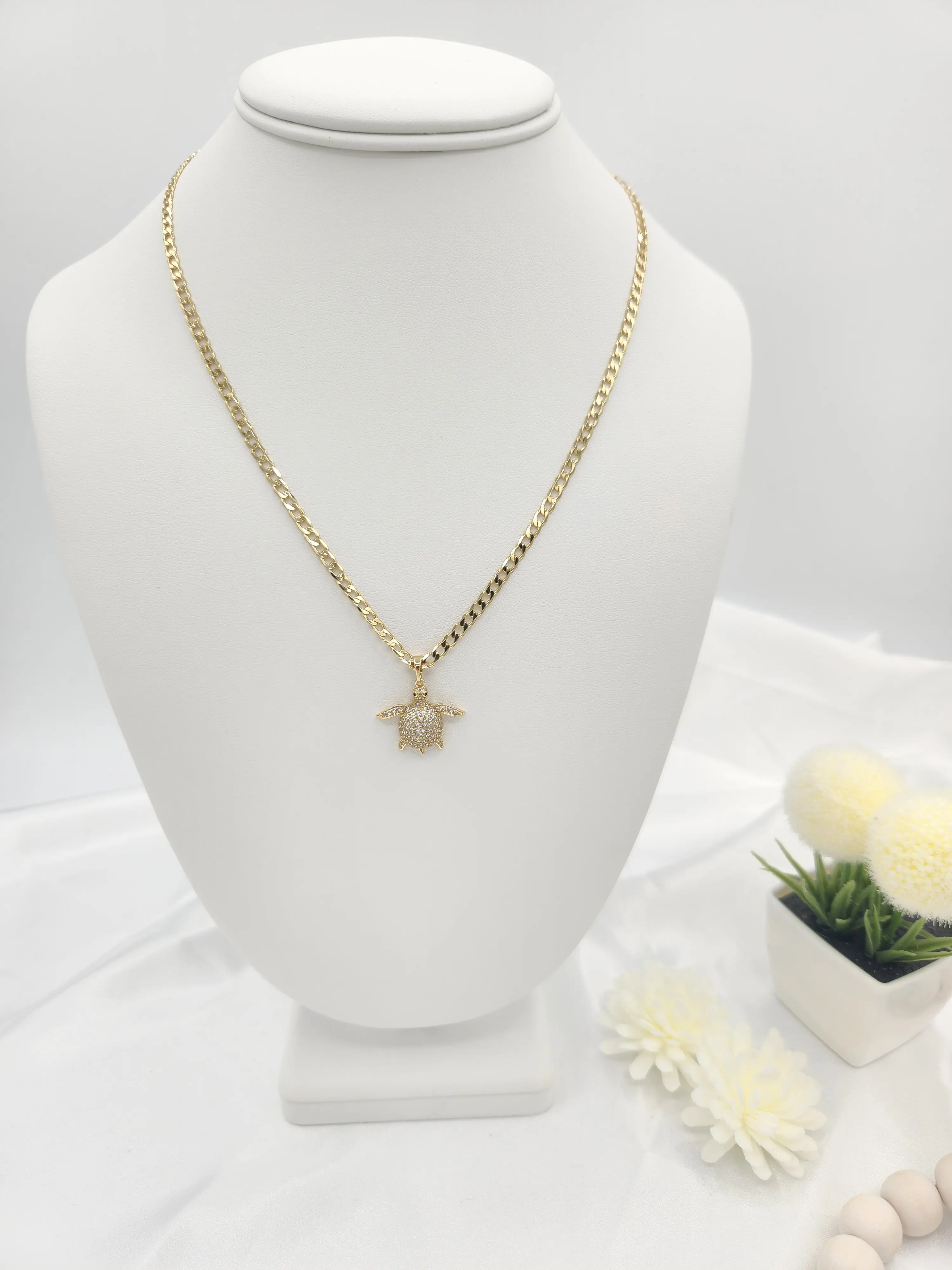 Cuban link chain with turtle pendant, 14K gold plated.