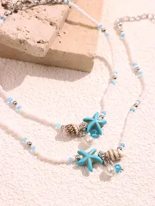Two-piece Bohemian handmade beaded anklet set featuring starfish and shells, adjustable, ideal for summer beach wear—vacation foot jewelry