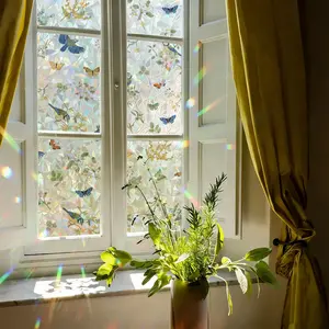 1 roll iridescent window film with floral and bird pattern, decorative privacy film for glass. Static cling, self-adhesive, removable and easy to apply. Ideal for windows and doors, enhancing home aesthetics and room décor.