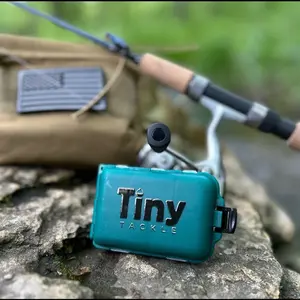 Tiny Tackle Ultralight Fishing Bundle- Includes 1 loaded Tiny tackle box, 1 pack of soft plastics, 20 jig heads, and one fishing hook hat clip!