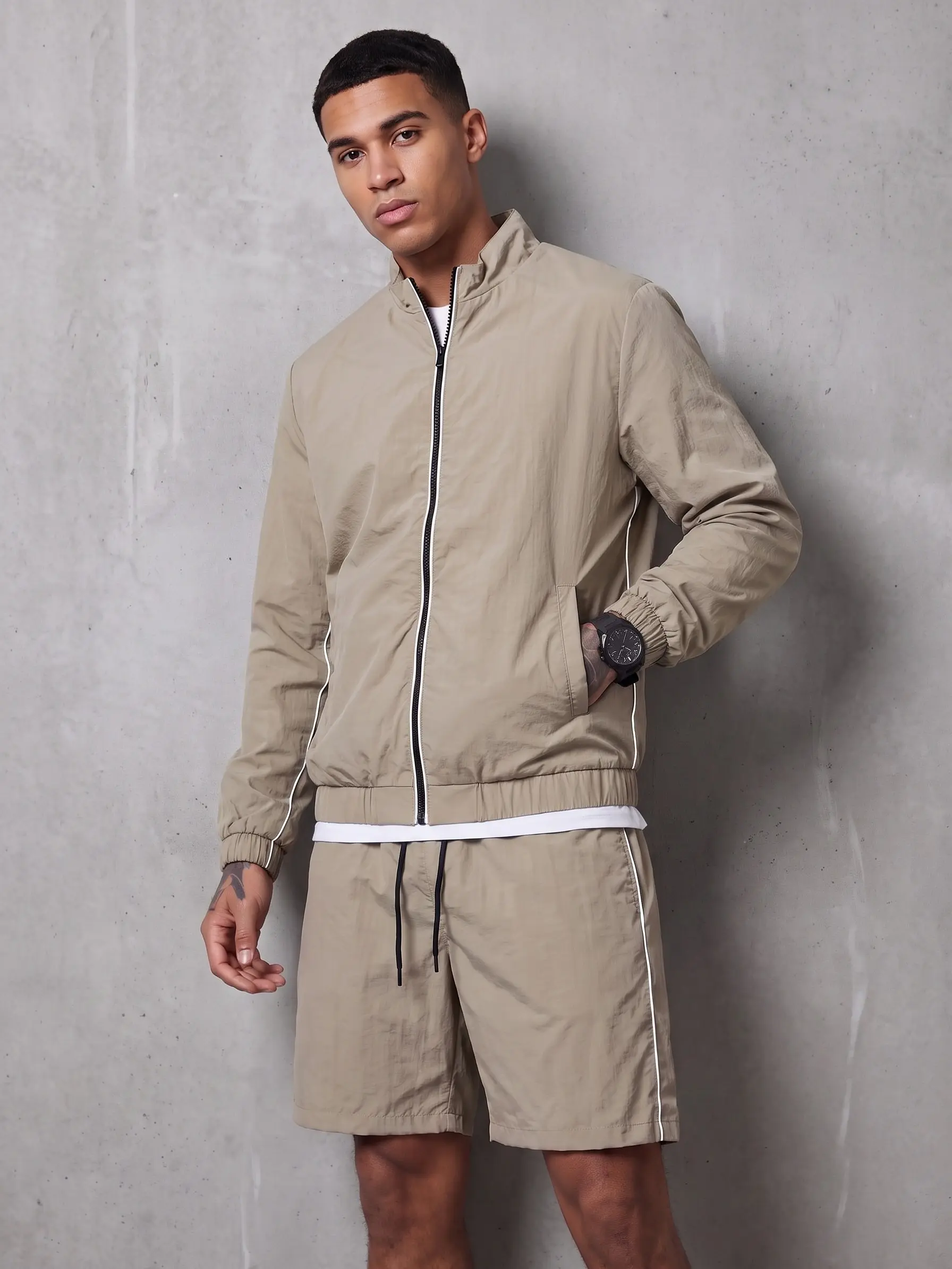 Minimalist sporty casual two-piece set: stand-collar cardigan jacket paired with drawstring shorts for men—lightweight, versatile for everyday wear.