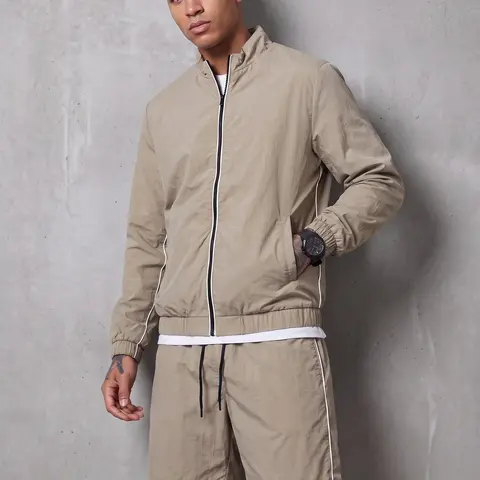 Minimalist sporty casual two-piece set: stand-collar cardigan jacket paired with drawstring shorts for men—lightweight, versatile for everyday wear.