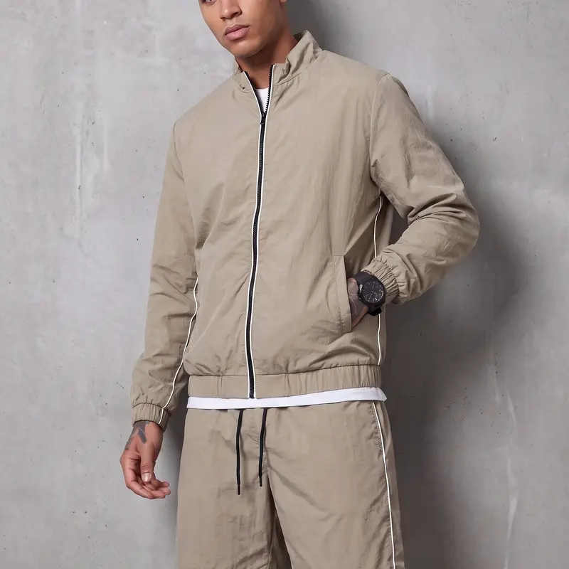 Minimalist sporty casual two-piece set: stand-collar cardigan jacket paired with drawstring shorts for men—lightweight, versatile for everyday wear.