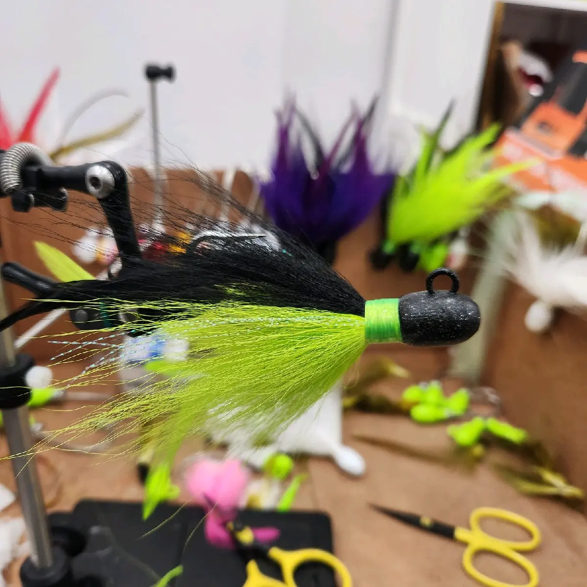1.5oz Custom Bucktail Jig with Feathers and Flash for saltwaterfishing. striped bass blue fish and flounder.