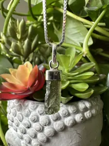 Authentic Moldavite Pendant with Necklace: A 1.6 grams genuine celestial gem, verified for authenticity. Embrace cosmic energies, deepen your spiritual connection, and leap to a transformation journey. Elevate your style and consciousness now.