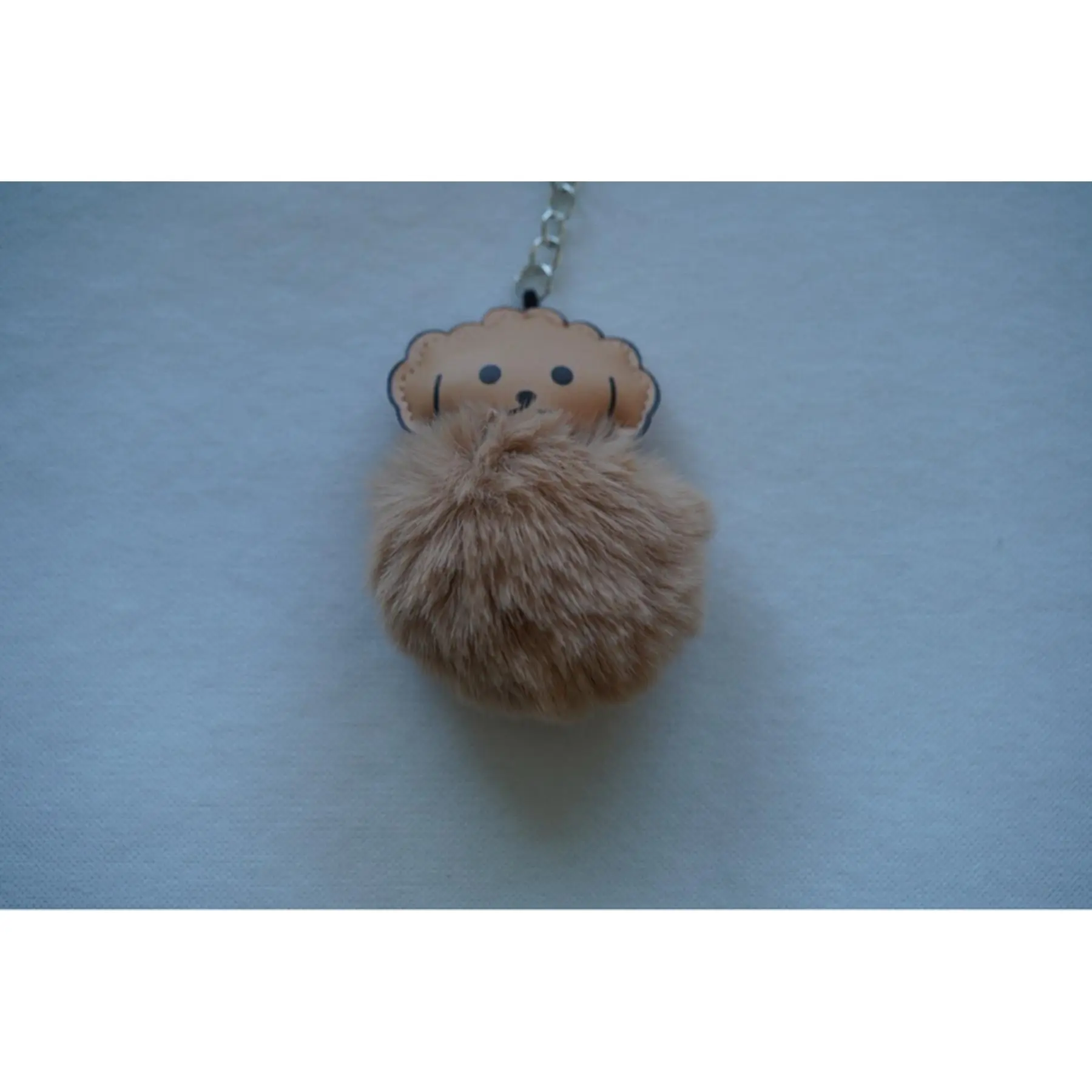Adorable Keychain with Fuzzy Design and Cute Face