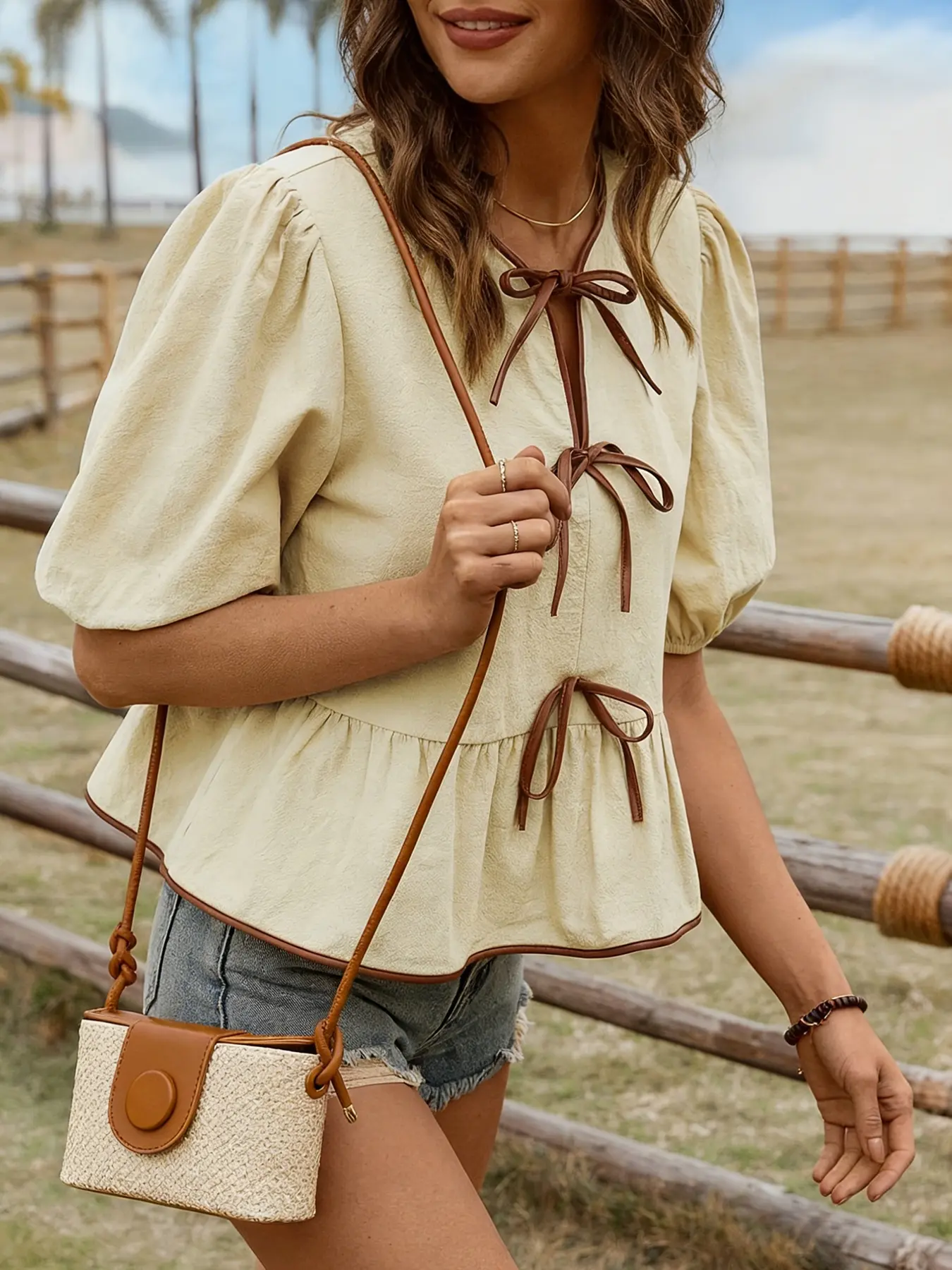 A women's apricot colored fashionable lace up bubble sleeve doll shirt Blouse, Dressy Boho Blouses, Boho Tops, with a lace up design that adds sweetness. The bubble sleeves cover the flesh and are suitable for commuting to work, shopping, and outdoor wear