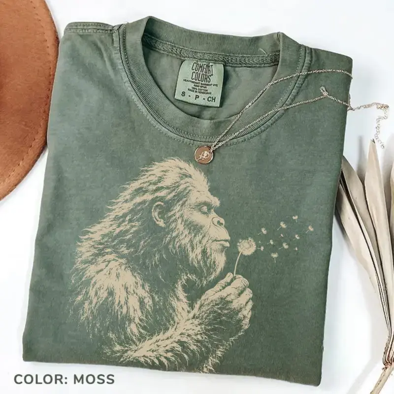 Comfort Colors Bigfoot Dandelion T-Shirt, Vintage Sasquatch Nature Tee, Woodland Cryptid Graphic T-Shirt, Outdoor Adventure Shirt, Bigfoot Lover Gif