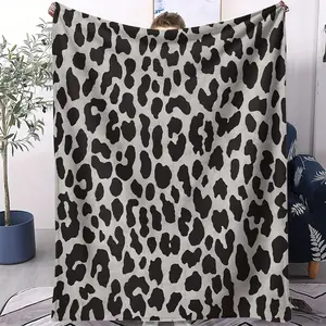 Cool Black And Gray Leopard Print Flannel Blanket Features A Striking Black And Gray Color Scheme, Exuding A Trendy And Unique Style. Suitable For Various Settings Including Sofas, Offices, Camping, And Bedrooms, It Also Makes A Great Gift.