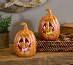 Set of 2 7" Illuminated Ceramic Jack-O-Lanterns by Valerie Set of 2 7" Illuminated Ceramic Jack-O-Lanterns by Valerie