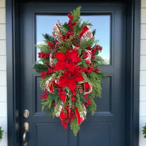 This Christmas arrangement with poinsettias & berries is a winter front door swag or holiday centerpiece for table or mantle Christmas decor