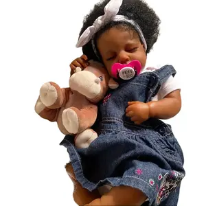 19" realistic sleeping youngster doll, hand painted details, curly black hair, soft touch vinyl limbs and cloth body Great for gifts and collectors, youngster doll