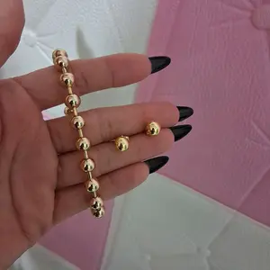 14 k gold laminated bead braceled and Errings set.