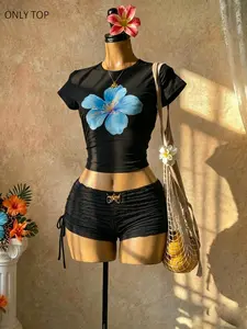 Women's blue hibiscus print crop top and babydoll style Y2K crop top, can be paired with pleated side-tie shorts, a stylish beach streetwear outfit, perfect for summer and vacation looks, TikTok trend: comfortable, tropical streetwear, Fashion
