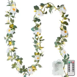 Suddus flower garland with white camellia fairy lights for indoor use, 60-LED vine string lights powered by batteries with remote control, artificial fake flowers and leaf lights for weddings, bedrooms, centerpieces, and arch decor