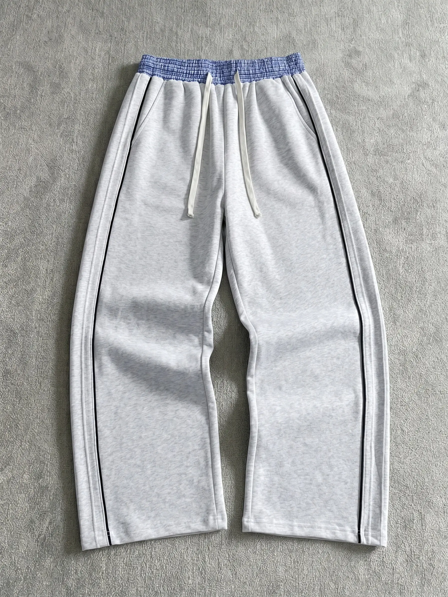 Men’s versatile wide-leg sweatpants for everyday wear featuring side stripes and a contrasting waistband with drawstring elastic waist; includes side pockets; soft and comfortable athletic pants suitable for office, home, and multiple other scenarios.
