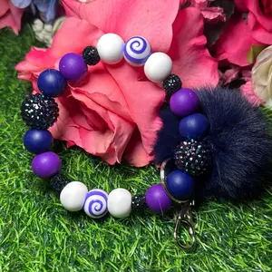 Navy swirl Wristlet Keychain color scheme navy, purple, white and bling beads made with wire