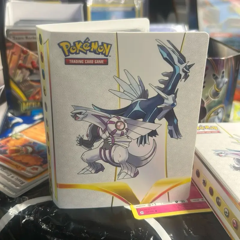 Pokemon mini binder with 50individually cards included. 40 Pokemon cards with possibly holos 1 ex or v or full art, 4 trainers and 5 energies.