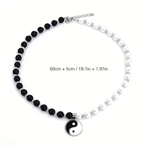 A fashionable and minimalist black and white pearl Tai Chi Bagua pendant necklace