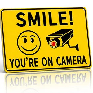 8x12 Inch Aluminum "Smile! You're On Camera" Metal Sign – Playful Yellow Security Wall Art for Yard, Business & Home. Smiley Face & Camera Design, High-Visibility & Rust-Free. Great for Deterring Trespassers with Humor.