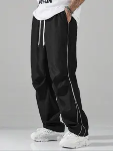 Men's solid color loose sports pants, leisure drawstring elastic waist wide leg running pants with pockets, comfortable daily wear, Athletic Bottoms