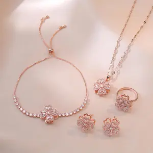 4-Piece Rose Gold Rotating Heart Flower Jewelry Set for Women – Trendy Necklace, Rotating Earring, Fashionable Micro-Inlaid Zircon, Titanium Steel Necklace, Bracelet, and Ring