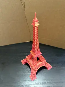 Eiffel Tower Statue - Orange Color Representation of the Famous Monument