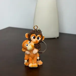 “Punch the Monkey” keychain — 2026 new 3D cute monkey plush toy hanging keychain for backpacks and car keys