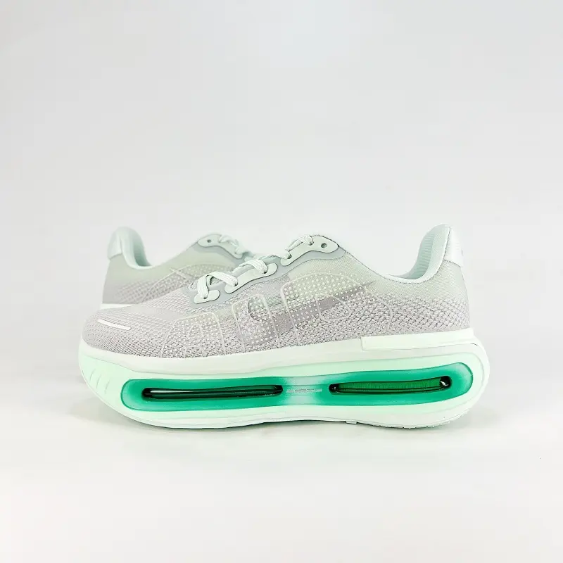 Pastel grey mesh sport shoes, translucent green air cushion unit, non‑slip rubber base, padded collar for everyday fitness wear