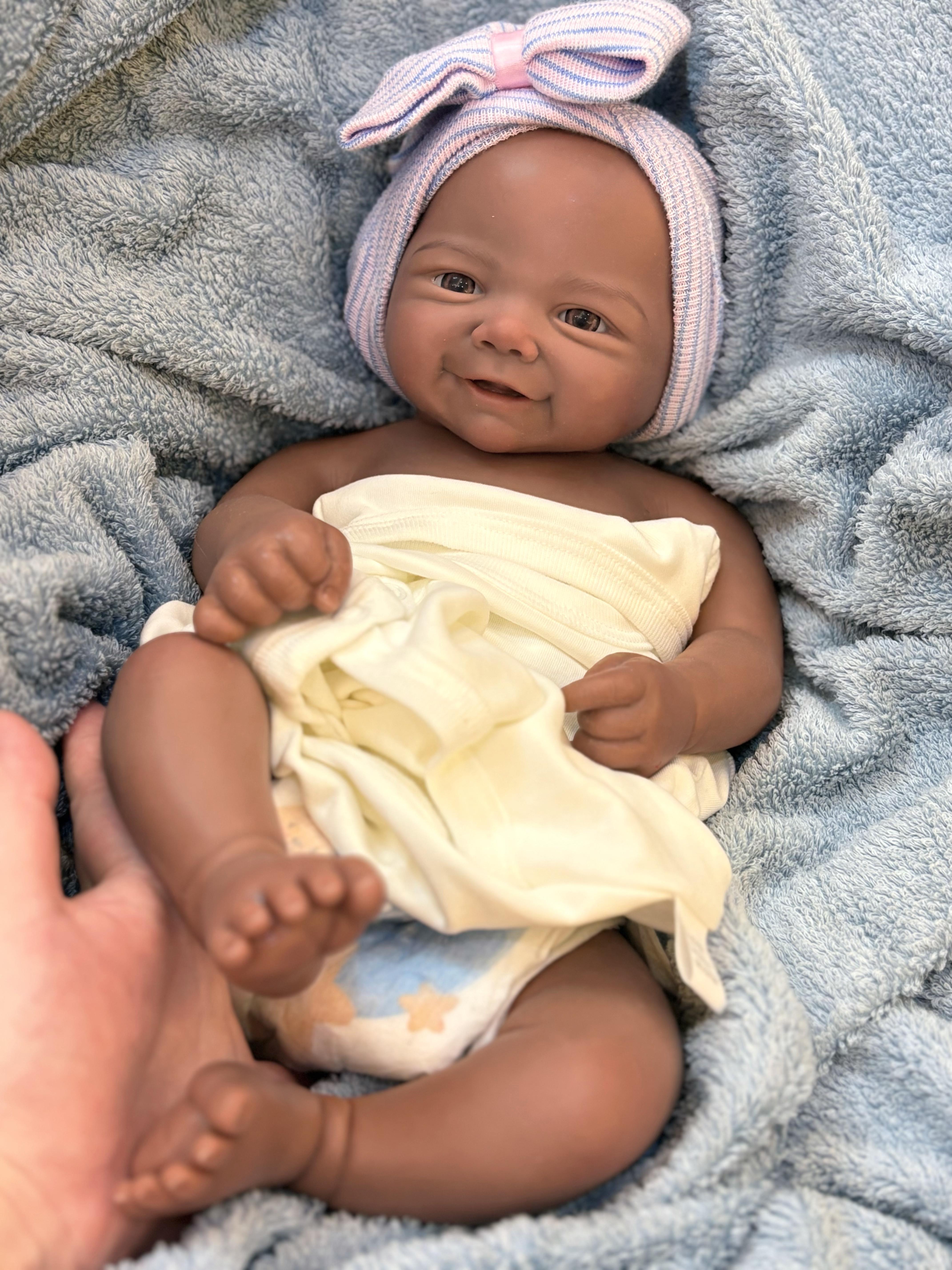 Reborn Doll Soft Silicone 18 inches Lifelike with Happy Smile Brown Skin Soft Body Realistic Details Includes Comfort Item Bottle Birth Certificate Perfect for Birthday Gifts Collectors and Children